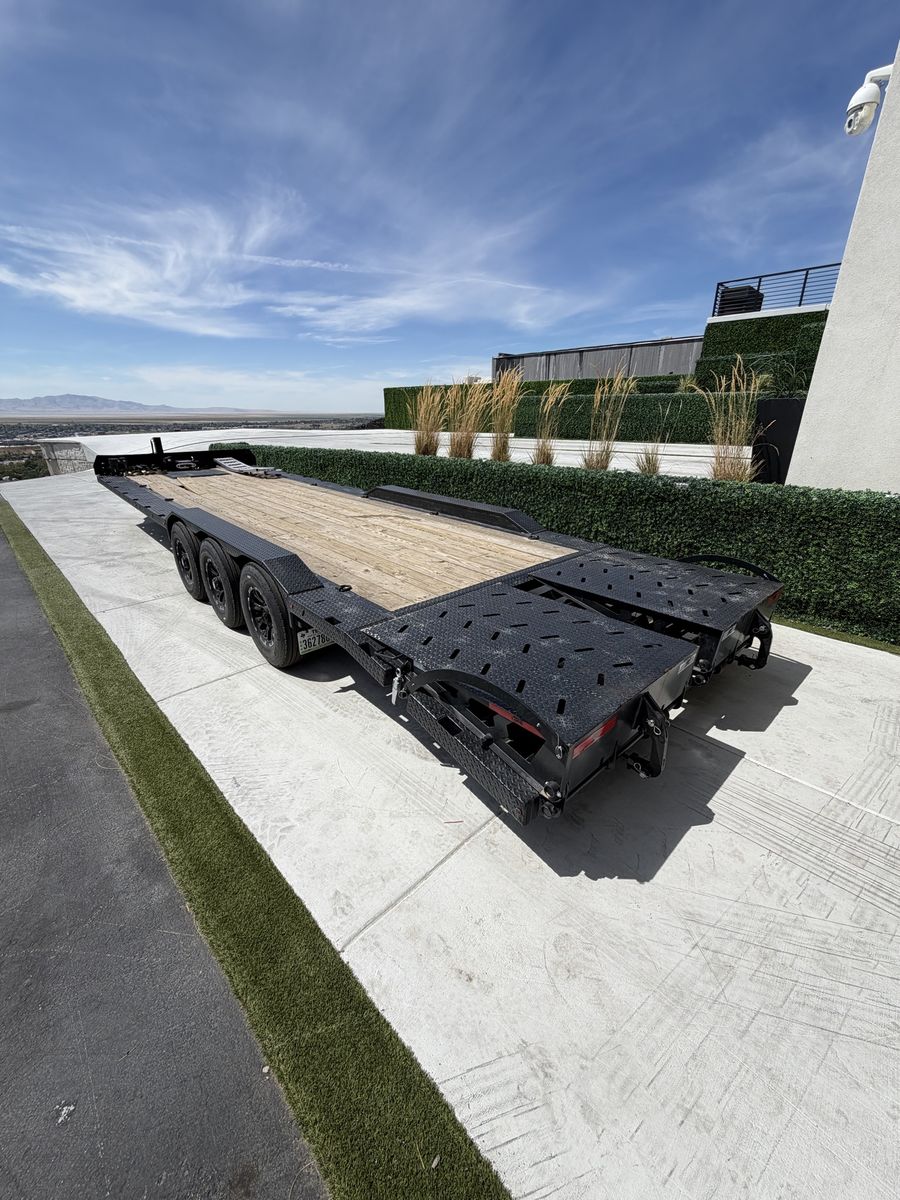 Super Champion APAK Trailers Flatbed Utility Trailer with ramps. Triple axle 21,000 GVR