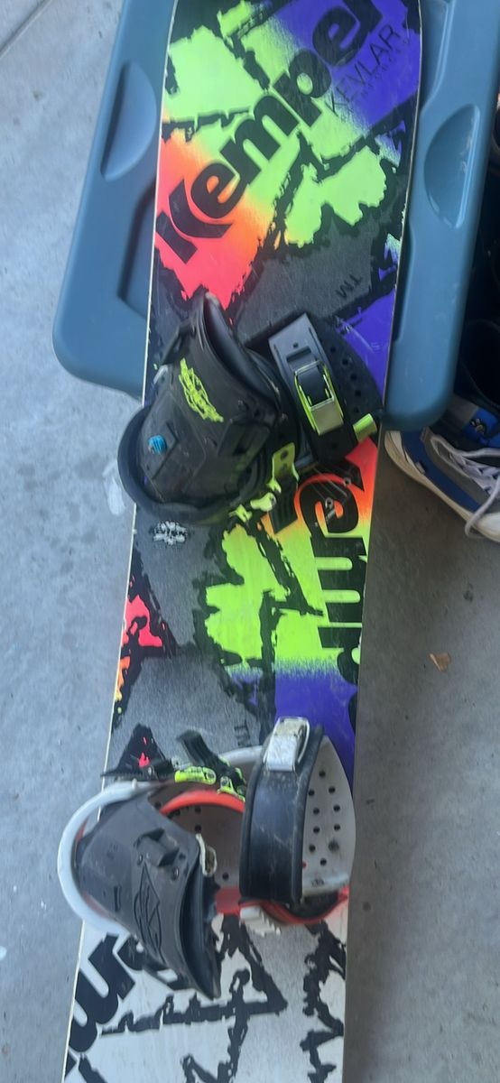 Snowboard with two pairs of boots