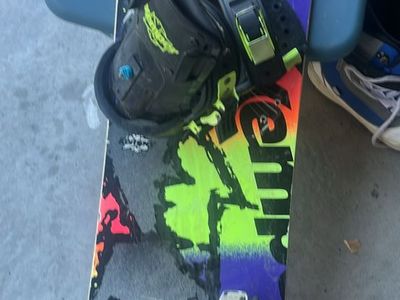 Snowboard with two pairs of boots