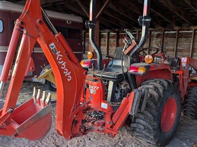 Tractor with Loader, Backhoe, Tiller, Scraper, Fence Post Auger, Brush Hog, and Operator for Hire