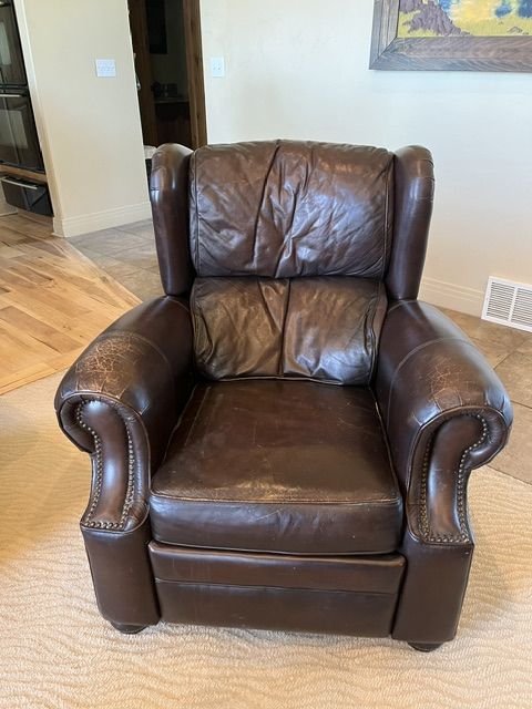 Luxurious Brown Leather Recliner Armchair - Nailhead Trim, Plush Comfort, Well-Maintained