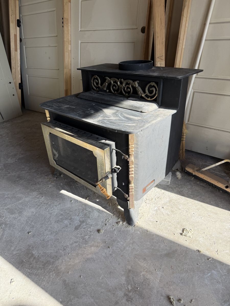 Never used Jamestown wood burning fireplace/stove