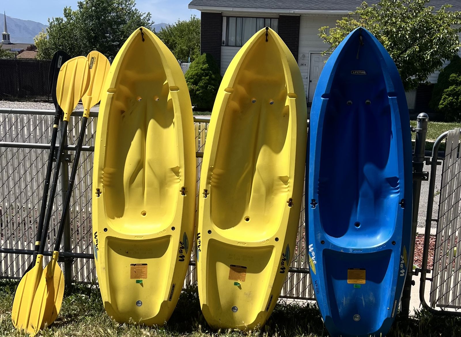 Youth kayaks with paddles
