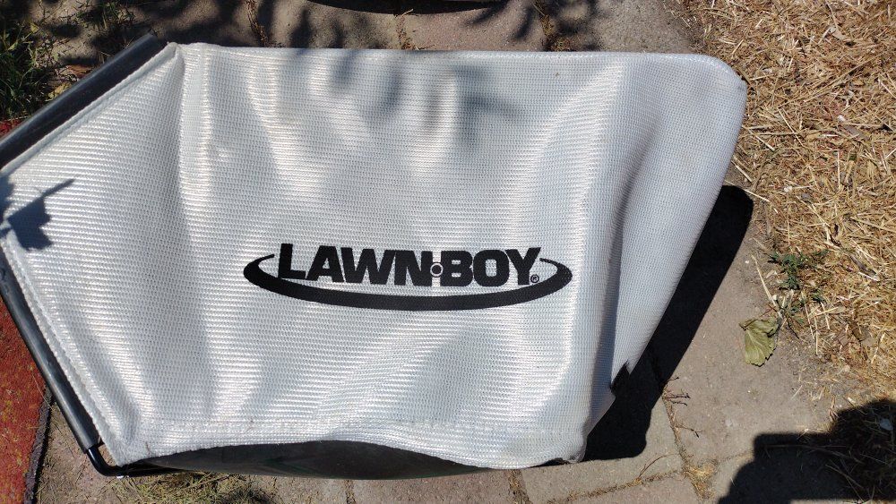 Lawn boy mower bag in excellent condition like new. See pictures for the mower  model