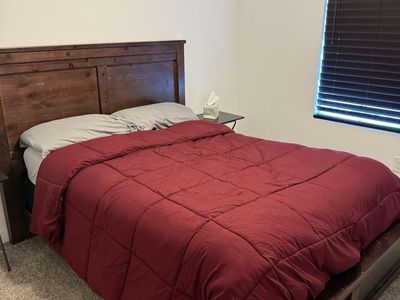 Dark wood bed with box and mattress