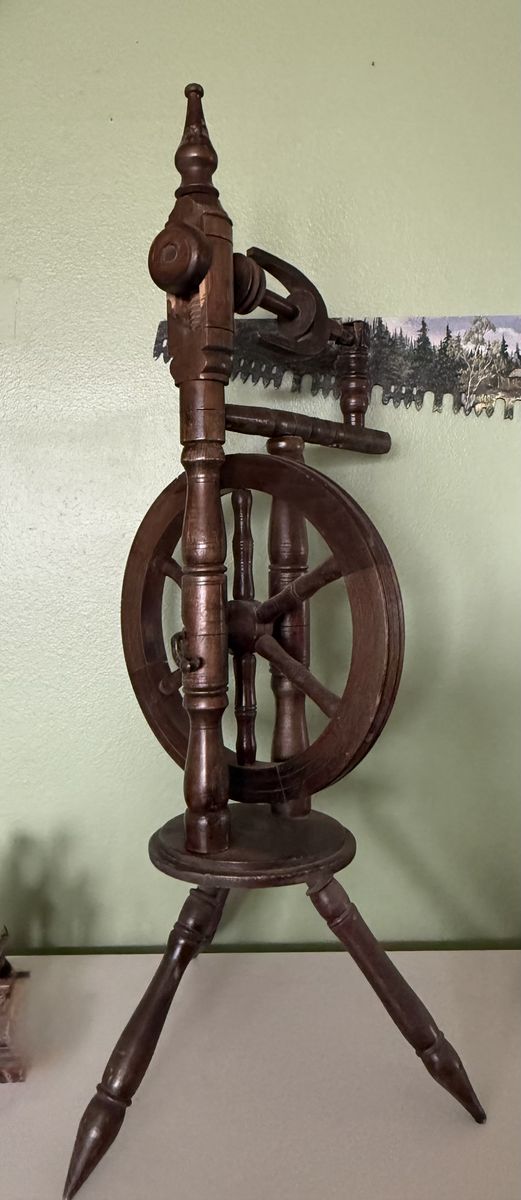 Antique upright castle-style spinning wheel