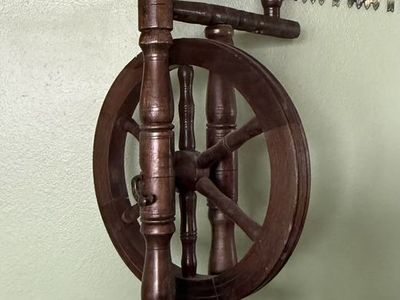 Antique upright castle-style spinning wheel