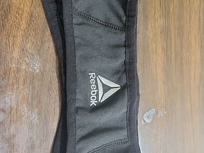 Reebok Black headband with ponytail hole