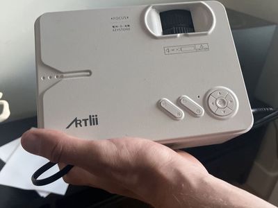 ARTlii Mini Projector - Compact Portable Home Theater Projector with Focus & Keystone