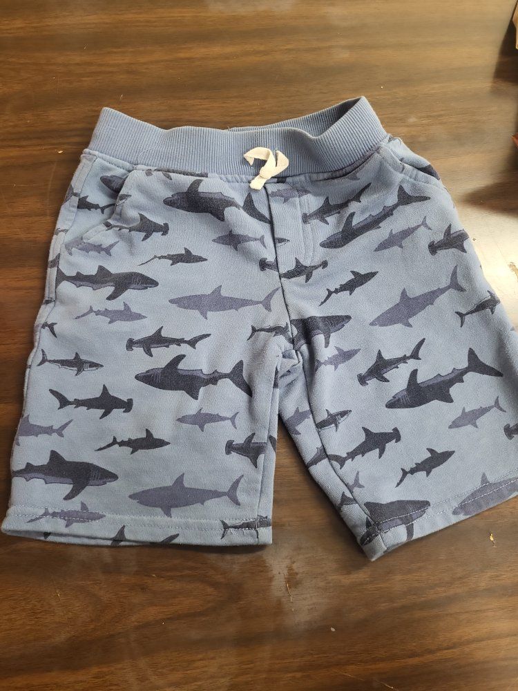 Boys shorts size 6 blue with navy blue sharks.