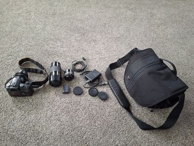 Sony A100 DSLR Camera Bundle with Multiple Lenses, Camera bag, Battery, Charger, and Accessories