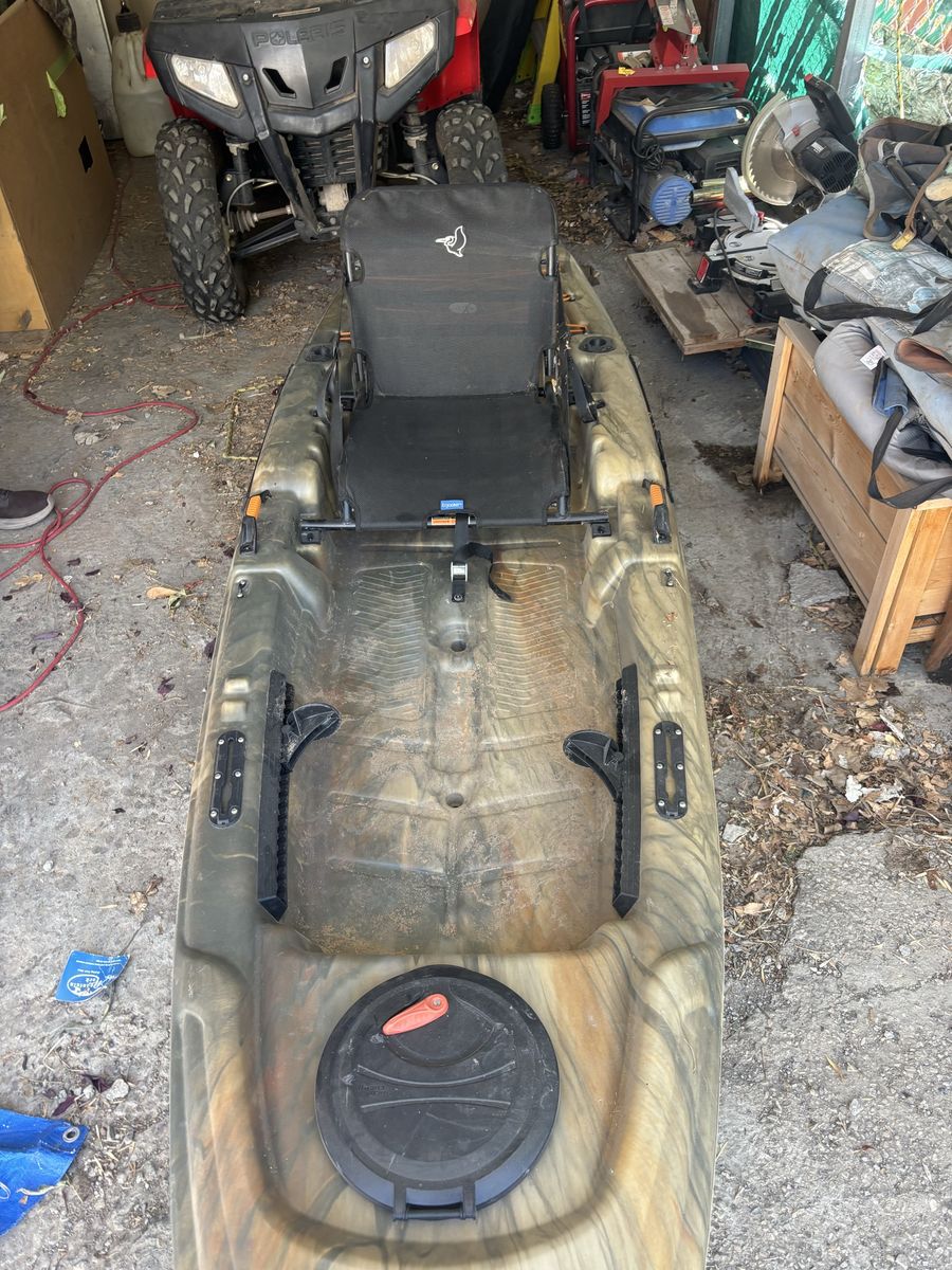Pelican Premium Camouflage Fishing Kayak with Adjustable Seat and Storage Hatch