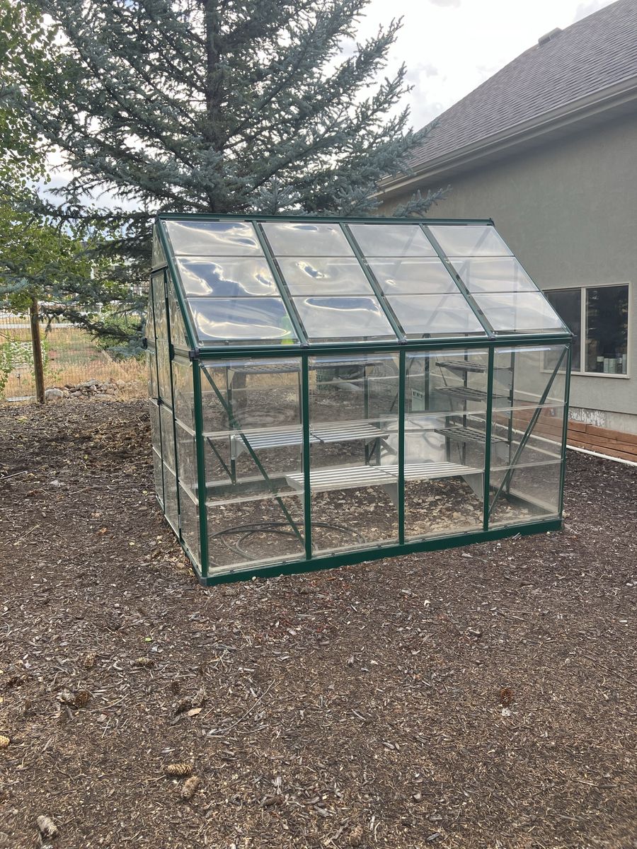 Palram Greenhouse with Shelving Units Used