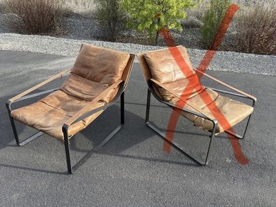 Beautiful genuine leather accent chair. Down filled cushions. Orig over $1,400 each new Great for Mid Century Modern MCM