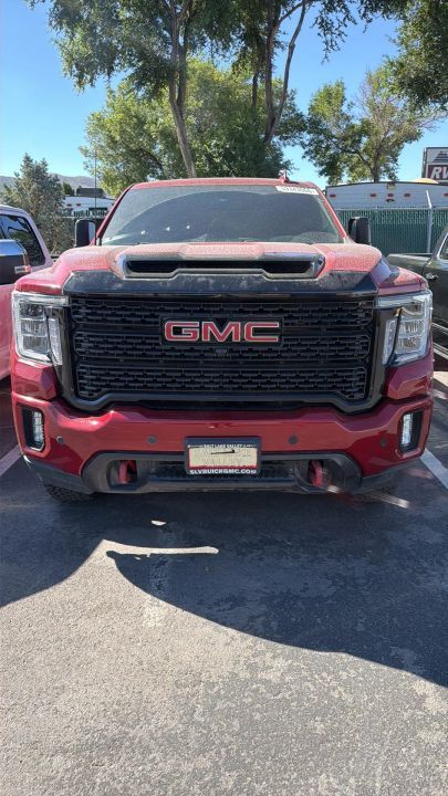 2022 GMC 2500 AT4 — rebuilt & branded title, 21% below market