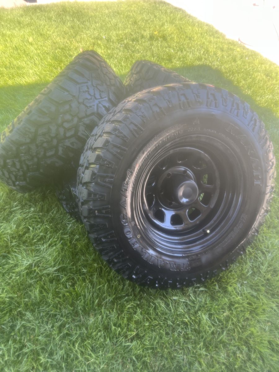 Kanati Trail Hog A/T-4 LT265/75R16 All-Terrain Tires & Black Steel Wheels Set 6x5.5