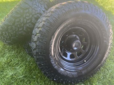 Kanati Trail Hog A/T-4 LT265/75R16 All-Terrain Tires & Black Steel Wheels Set 6x5.5