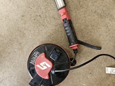 Snap-on Retractable Cord Reel Work Light with Built-in Outlet