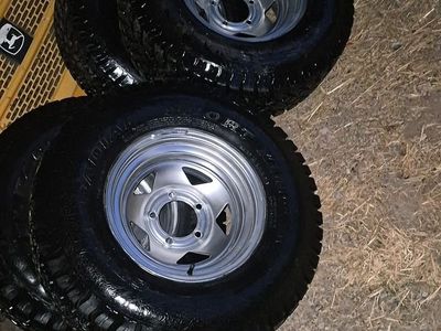 Set of 4 All-Terrain Tires Mounted on Silver Steel Wheels Rims