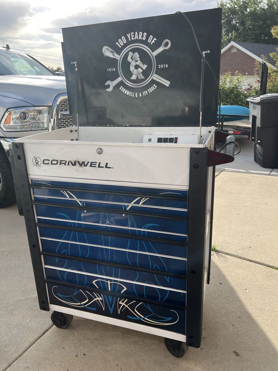 Cornwell Tools 100 Years Edition 7-Drawer Rolling Tool Cart with Power Strip and has tools