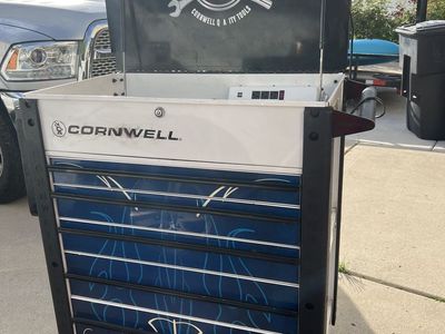 Cornwell Tools 100 Years Edition 7-Drawer Rolling Tool Cart with Power Strip and has tools
