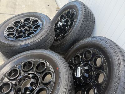 Set of 4 Ford f350 Black Beadlock Capable Wheels w/ Bridgestone Dueler A/T Tires 20 inxh 8x170