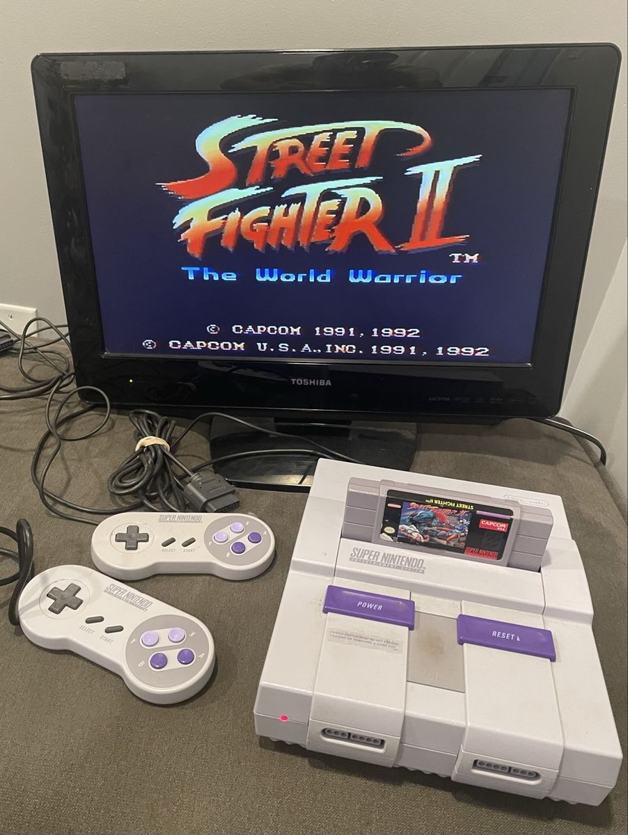 Super Nintendo SNES Console Bundle OEM with 2 Controllers, all the necessary cables and Street Fighter II
