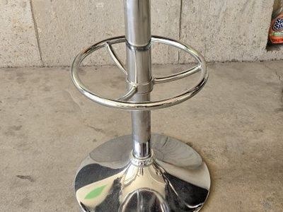 Red Swivel Bar Stool with Chrome Finish, Adjustable Height, and Footrest