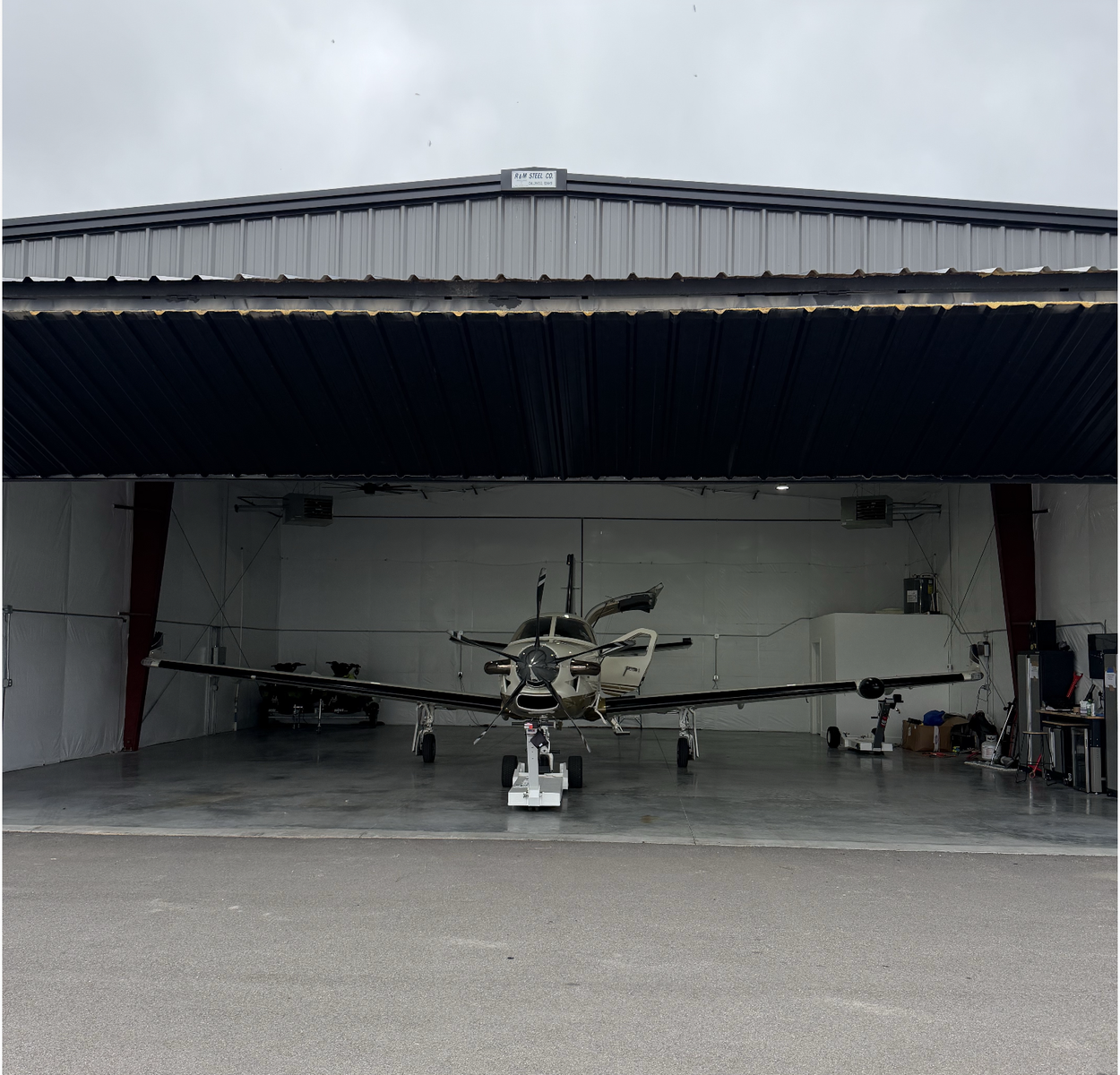 Airplane hangar building with direct runway access
