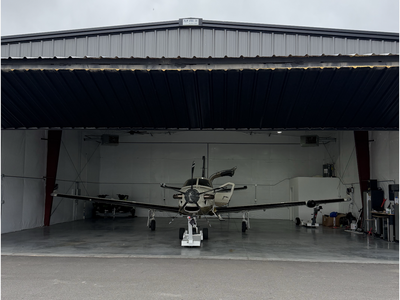 Airplane hangar building with direct runway access