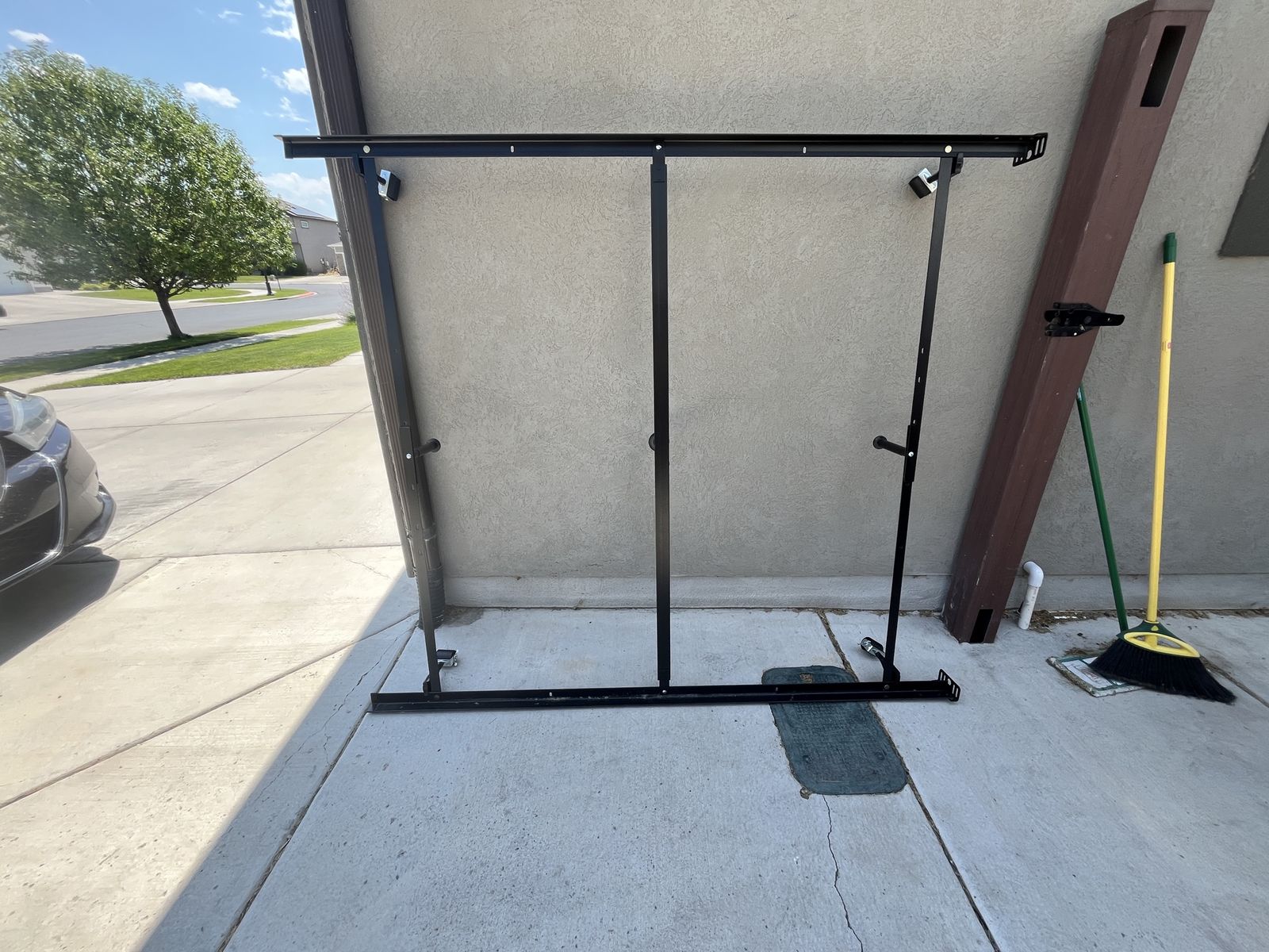 Queen-size Adjustable Black Metal Bed Frame with Center Support Rail and Casters