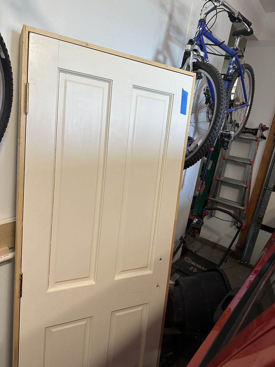 Quality solid wood interior doors removed during a remodel. These are not hollow-core or MDF—they are solid wood construction.