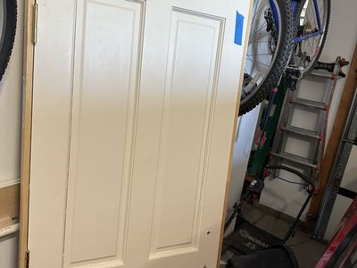 Quality solid wood interior doors removed during a remodel. These are not hollow-core or MDF—they are solid wood construction.