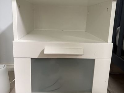 IKEA nightstand with open shelf and drawer with frosted glass pane