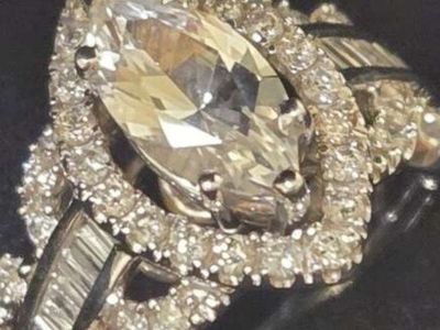 Marquise Cut Halo Diamond Engagement Ring with Baguette and Round Accent Stones