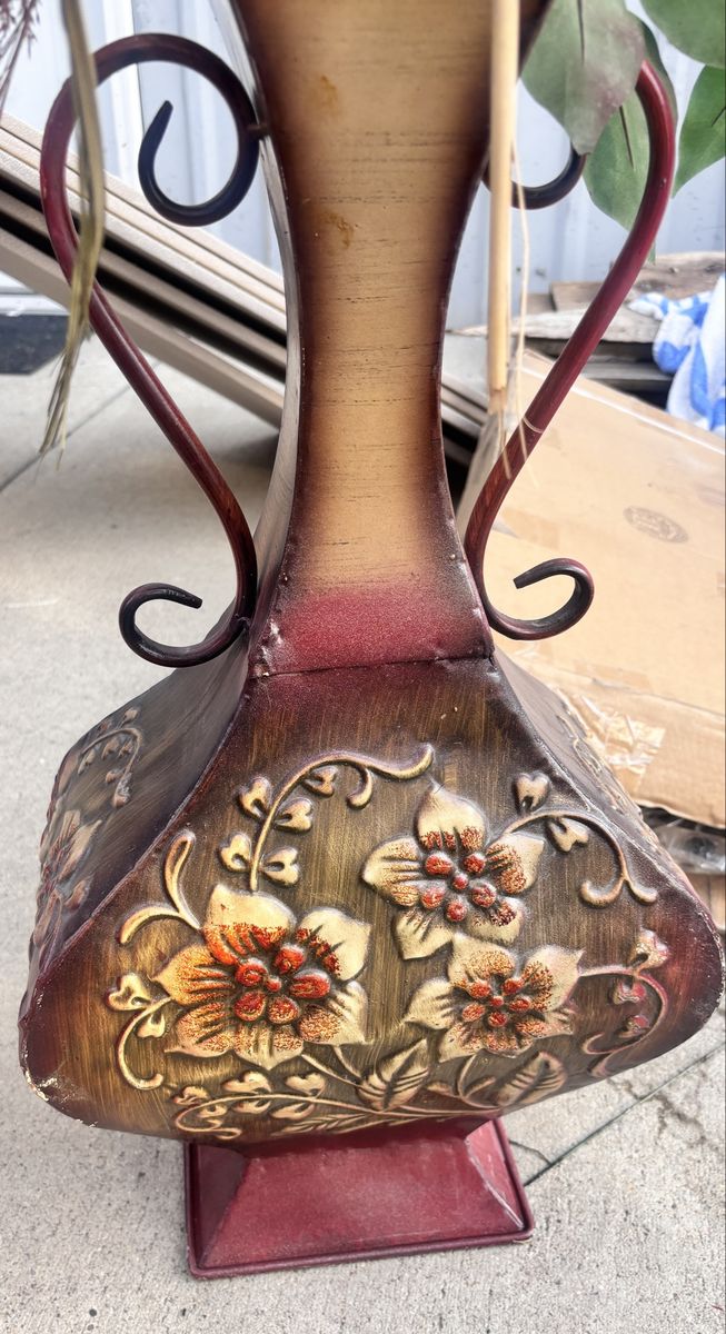 Decorative Metal Urn Vase with Embossed Floral Design and Artificial Botanical Arrangement