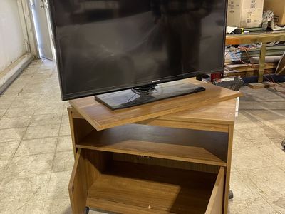 Rollable Wooden TV swivel stand. TV not included