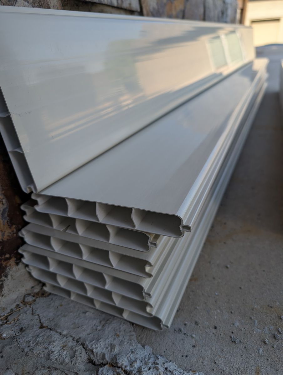7 brand new vinyl fence panel pieces left over from our project