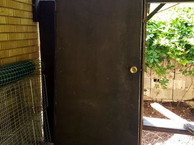 Outside door with frame and door knob