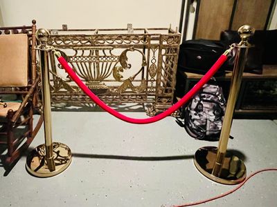 2 STACHIONS AND 1 VELVET RED ROPE