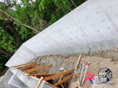 CONCRETE RETAINING WALL - CONCRETE WALL - SYMONS FORMS - FOOTING - FOUNDATION - BASEMENT - VERTICAL CONCRETE