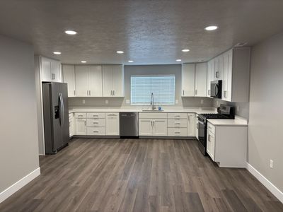 Newly finished separate basement entry apartment with 2 car garage.