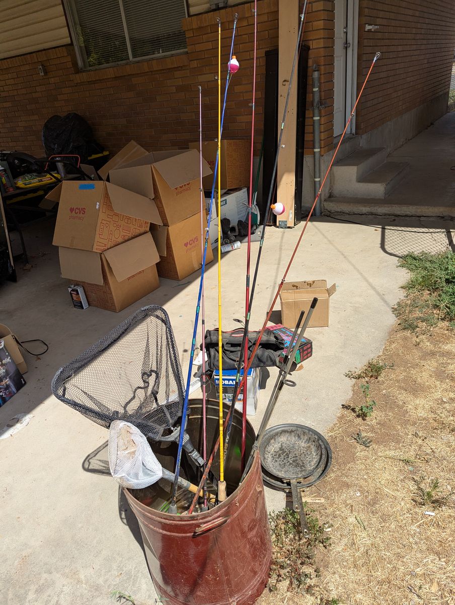 7 Fishing Poles and 2 Fish Nets.