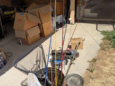 7 Fishing Poles and 2 Fish Nets.