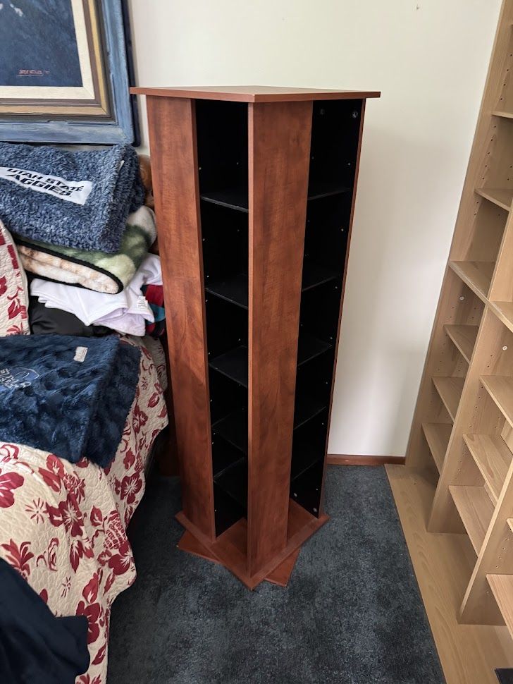 Rotating Media Tower Shelving Unit in Cherry Wood Finish