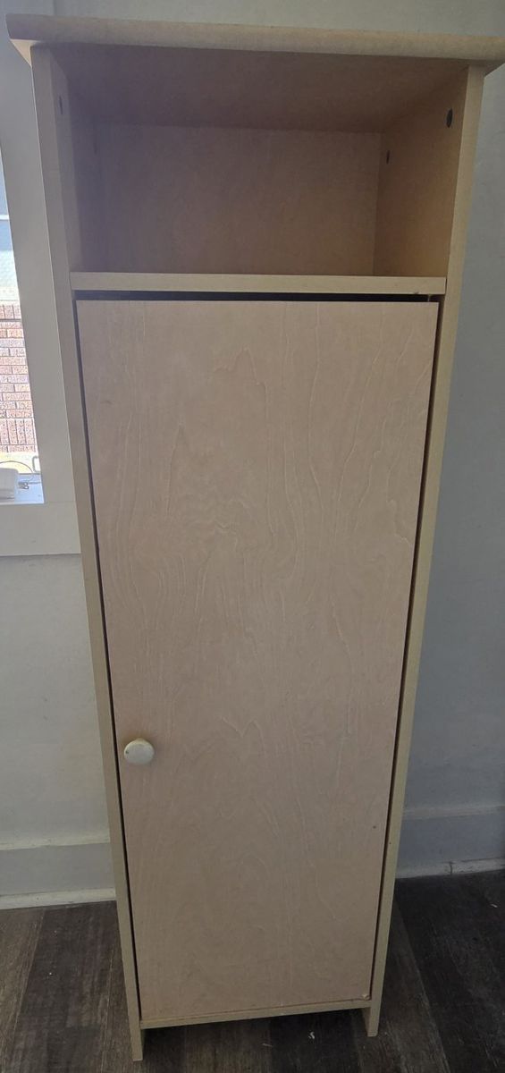 Ikea natural-color cupboard sits on floor 17L x23W ×54.5H by downtown