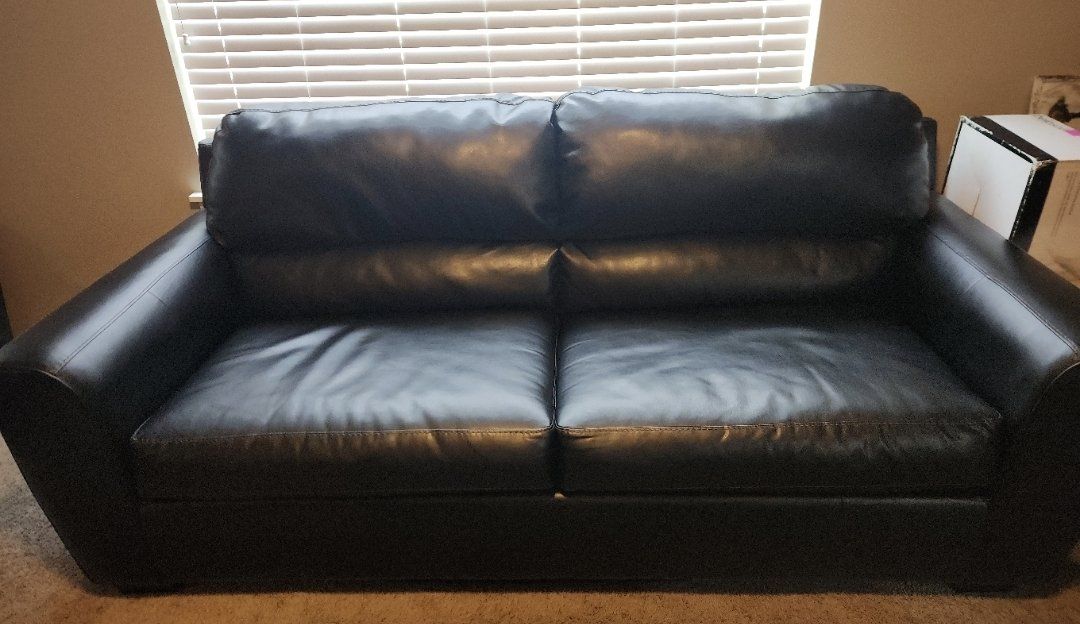 Black faux leather loveseat and sofa