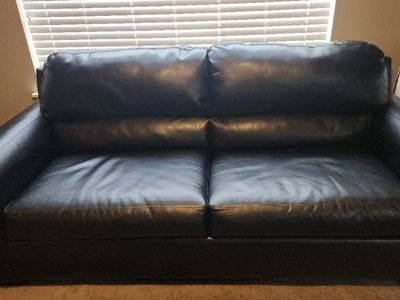 Black faux leather loveseat and sofa