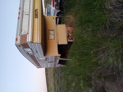 About a 11 foot cab over Camper