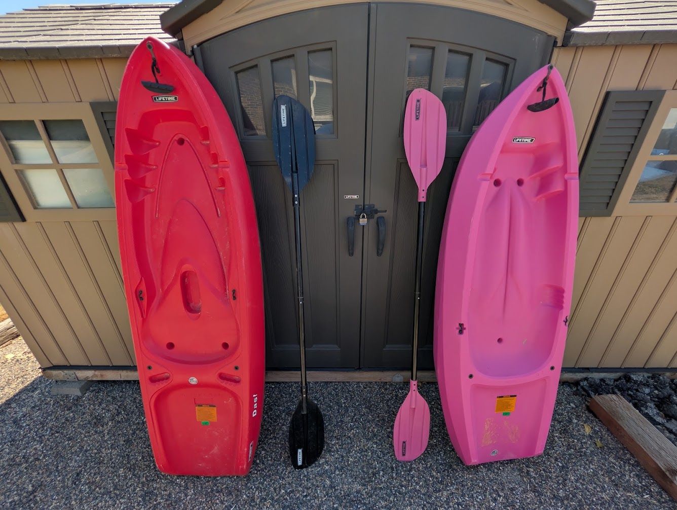 Youth sit on Kayaks